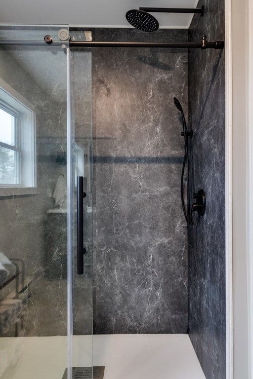 bathroom featuring an enclosed shower