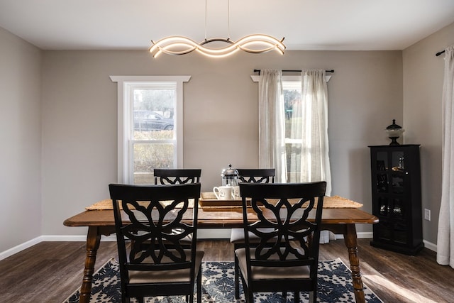 dining area with dark wood-type flooring