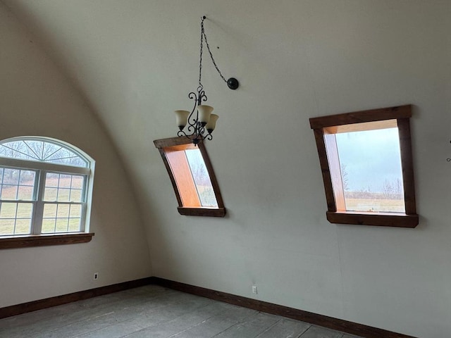 empty room with vaulted ceiling