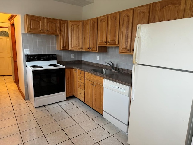 kitchen featuring white appliances, sink, decorative backsplash, and light tile patterned floors