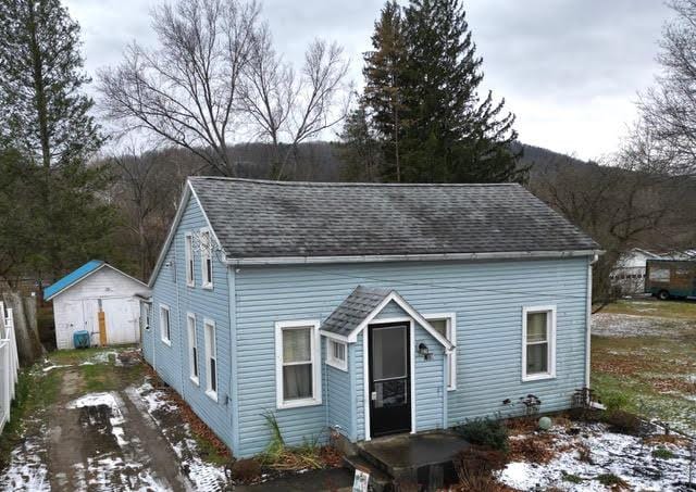 view of front facade with a storage unit