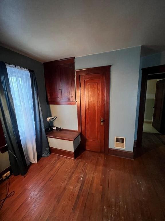 kitchen with dark wood-type flooring