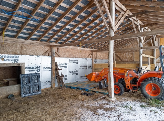 miscellaneous room with lofted ceiling