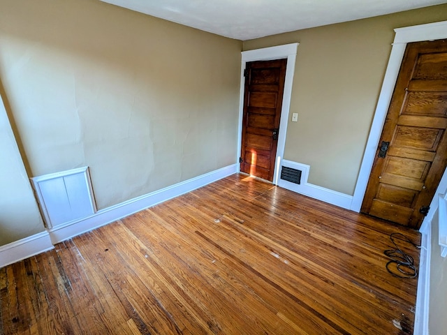 unfurnished bedroom featuring hardwood / wood-style flooring