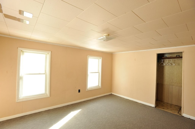 carpeted spare room with ornamental molding