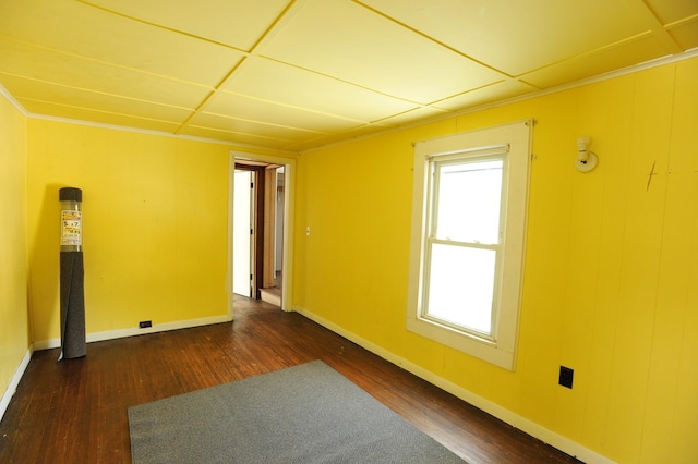 unfurnished room featuring dark hardwood / wood-style flooring