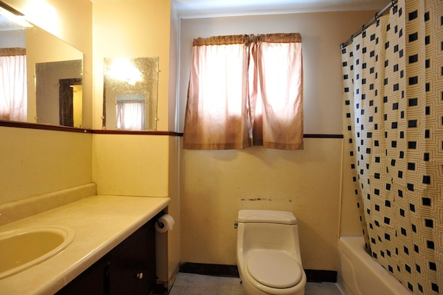 full bathroom with vanity, toilet, and shower / tub combo