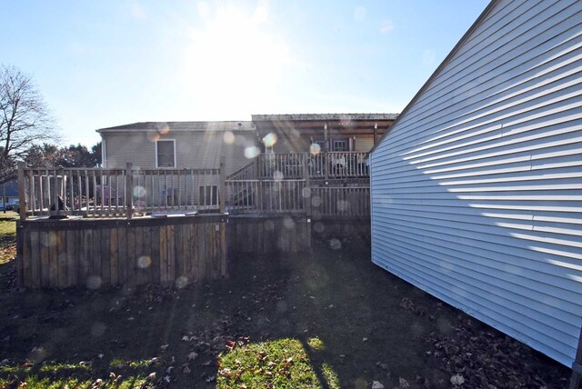 view of yard featuring a wooden deck