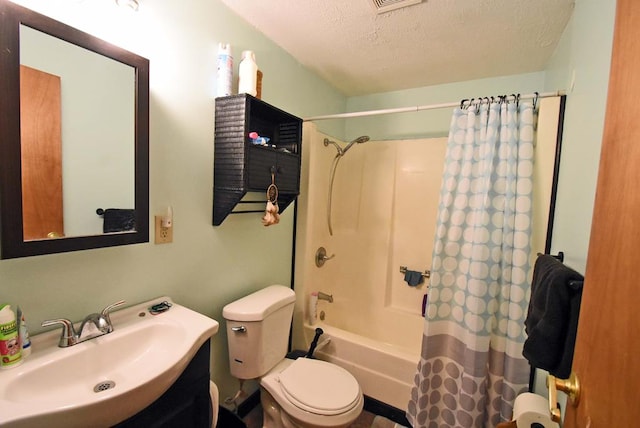 full bathroom with vanity, toilet, shower / bath combination with curtain, and a textured ceiling