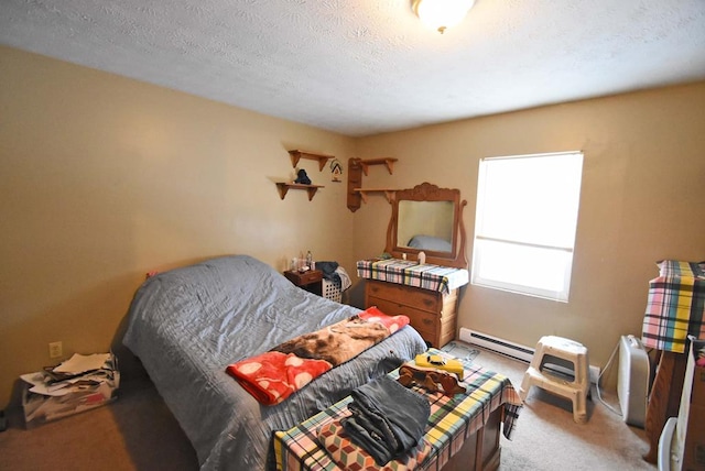 carpeted bedroom with a textured ceiling and baseboard heating