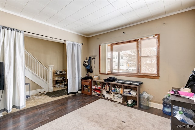 misc room featuring ornamental molding and dark hardwood / wood-style floors