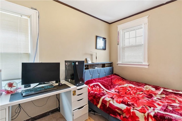 bedroom with ornamental molding and carpet