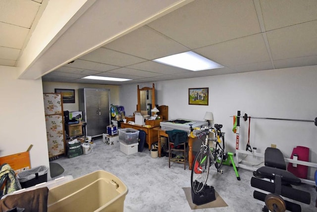 basement with a paneled ceiling