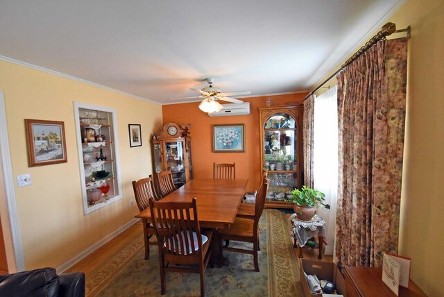 dining room featuring crown molding, dark wood-type flooring, a wall mounted air conditioner, and ceiling fan