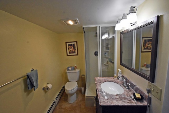 bathroom with vanity, a shower with door, toilet, and baseboard heating