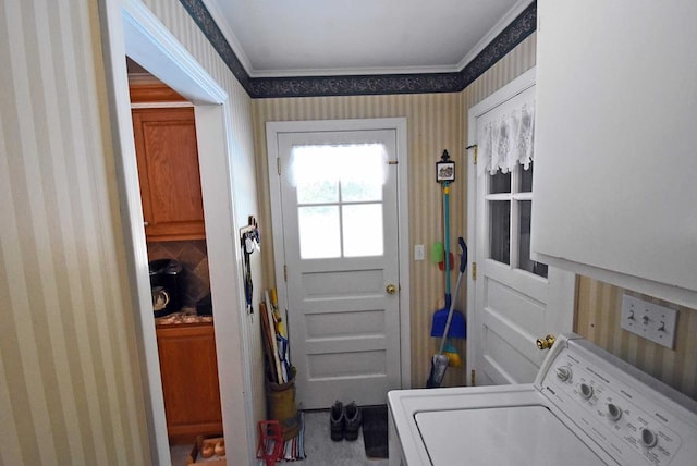 laundry area featuring washer / clothes dryer and crown molding