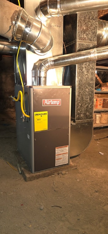 utility room with heating unit