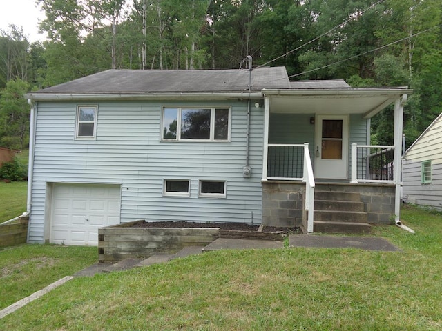 exterior space featuring a garage, a porch, and a front lawn