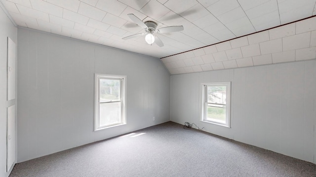 spare room with carpet, lofted ceiling, and ceiling fan