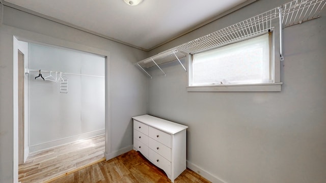 spacious closet with light hardwood / wood-style floors