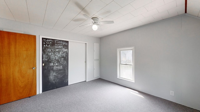 unfurnished bedroom featuring ceiling fan, carpet flooring, and a closet