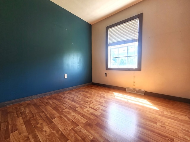 spare room featuring light wood-type flooring