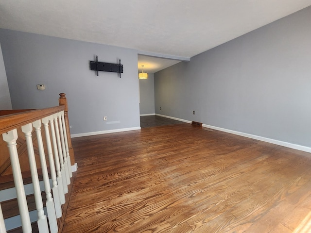 spare room with wood-type flooring