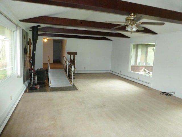 spare room featuring lofted ceiling with beams, a baseboard radiator, and ceiling fan