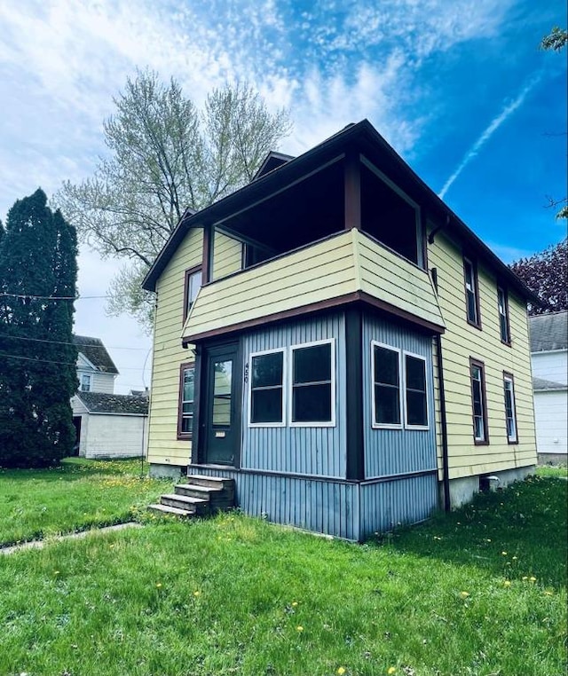 view of home's exterior featuring a lawn