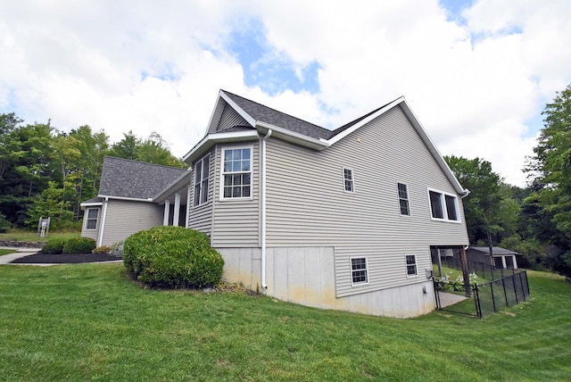 view of property exterior with a yard