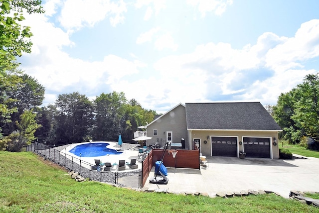 view of swimming pool featuring a yard and a patio