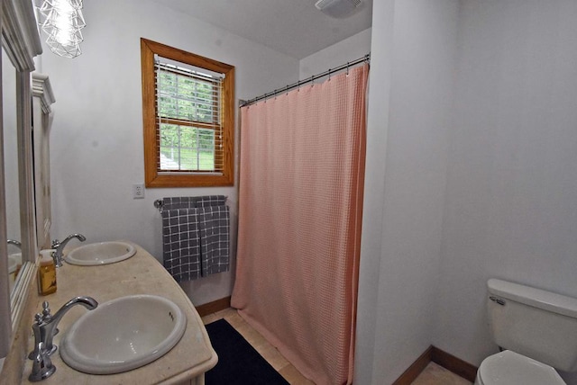 bathroom featuring vanity, a shower with curtain, and toilet