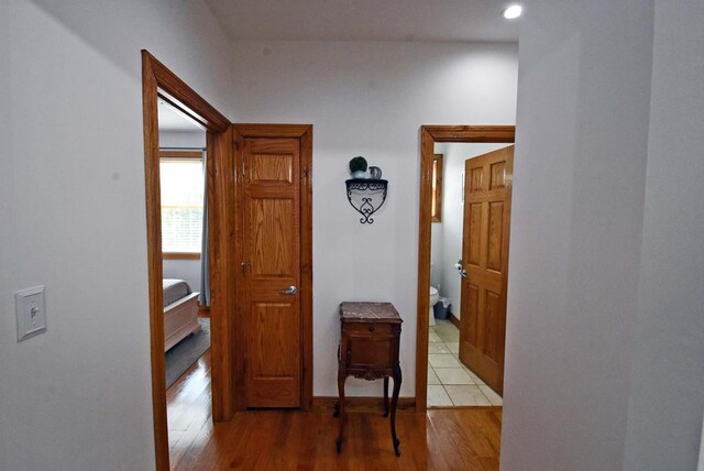 corridor featuring light hardwood / wood-style floors