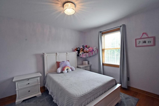 bedroom featuring dark wood-type flooring