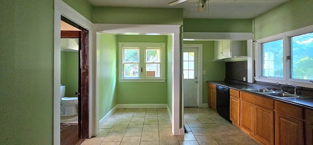 kitchen with light tile patterned flooring, ceiling fan, dishwasher, and sink