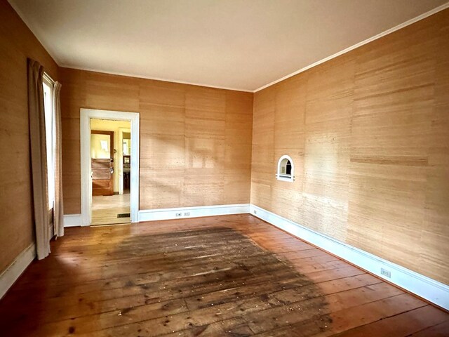 spare room with dark hardwood / wood-style flooring