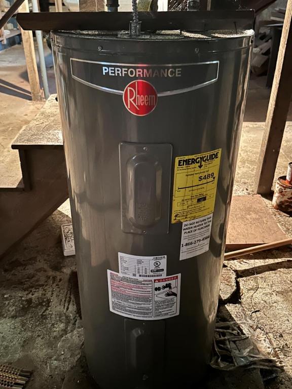 utility room with electric water heater