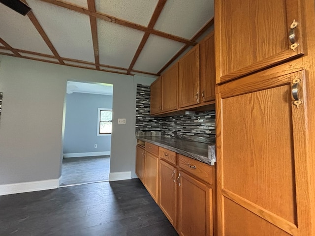 kitchen featuring mail boxes, backsplash, and dark hardwood / wood-style flooring