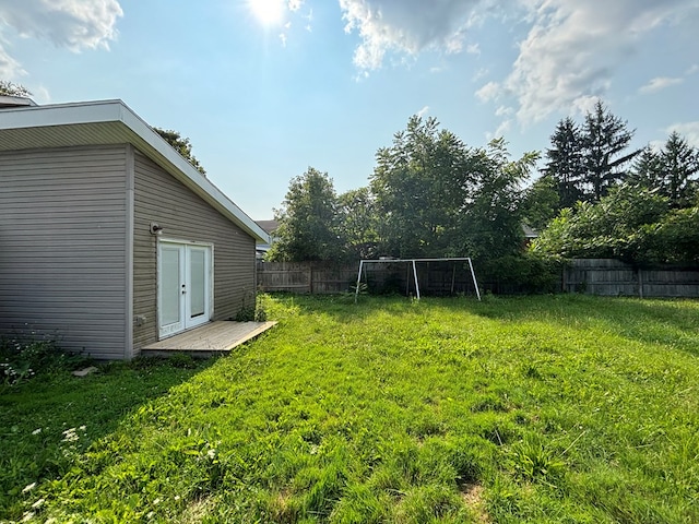 view of yard with french doors