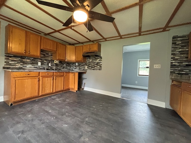 kitchen with ceiling fan, dark hardwood / wood-style floors, sink, and decorative backsplash