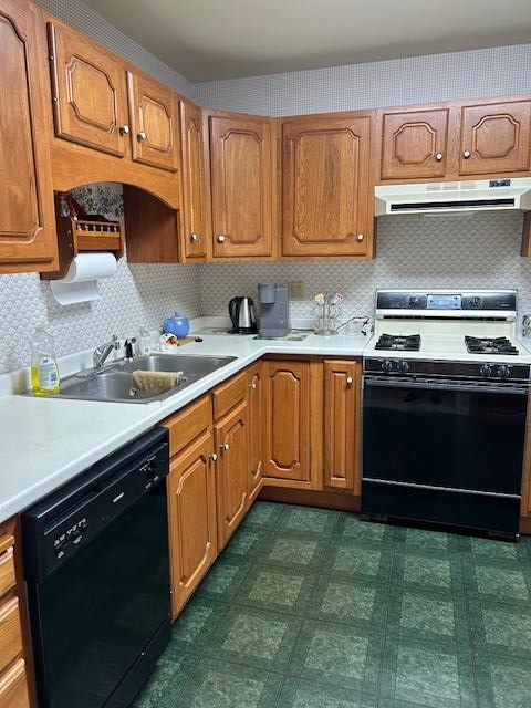 kitchen with black dishwasher, sink, backsplash, and range with gas cooktop