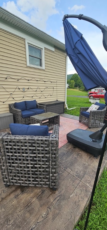 view of patio / terrace featuring a wooden deck and outdoor lounge area