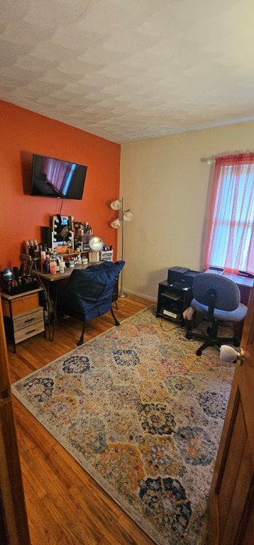 office space featuring hardwood / wood-style flooring and a textured ceiling