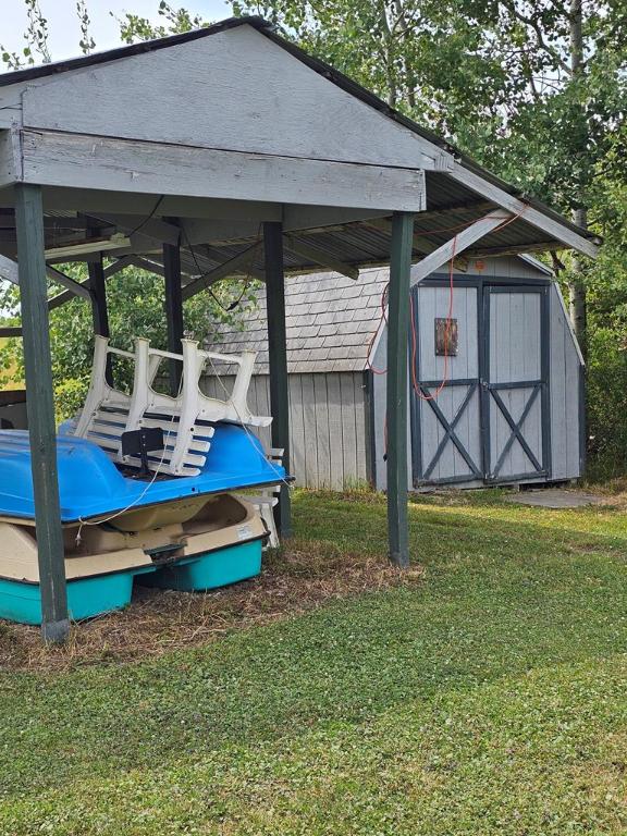 view of outdoor structure with a yard