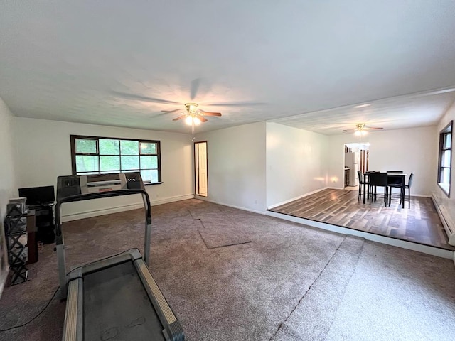 workout area featuring dark colored carpet and ceiling fan