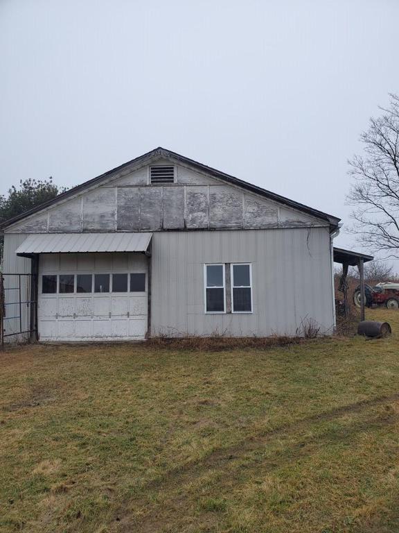 garage featuring a yard