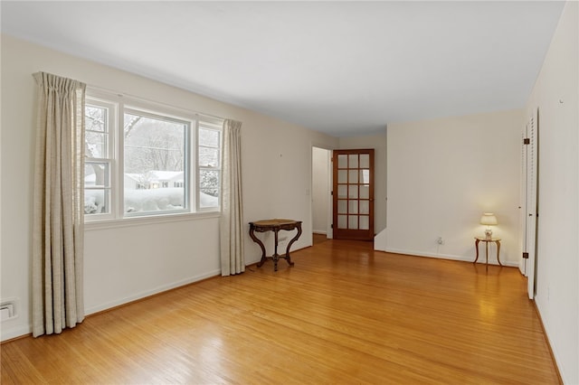 unfurnished room featuring light hardwood / wood-style floors