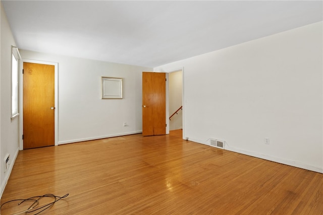 unfurnished room with light hardwood / wood-style flooring