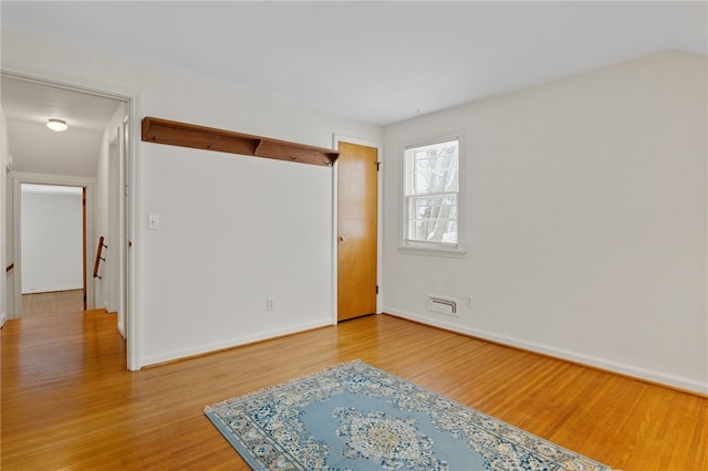 empty room featuring wood-type flooring