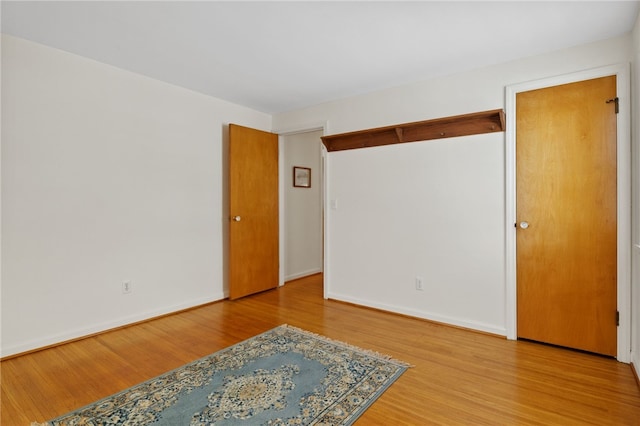 spare room with wood-type flooring